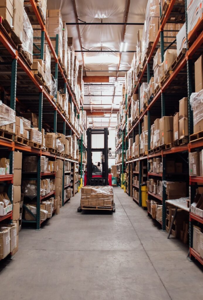 Hero Panel Image Reach Truck putting a pallet away in a warehouse pallet racking