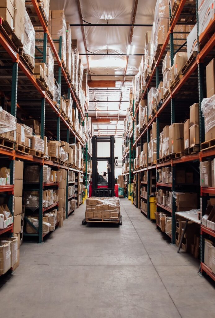 Reach Truck putting a pallet away in a warehouse pallet racking